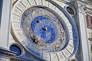 Astronomical clock in Venice with gold zodiac signs, Italy