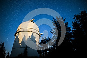 Astronomical Observatory under the night sky stars. Vignette