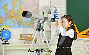 Astronomy and Astrophysics. Stars and galaxies. Study telescope. School astronomy lesson. School girl looking through