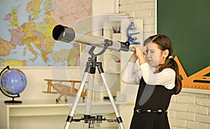 Astronomy and Astrophysics. Stars and galaxies. Study telescope. School astronomy lesson. School girl looking through