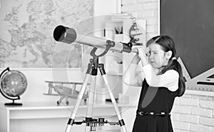 Astronomy and Astrophysics. Stars and galaxies. Study telescope. School astronomy lesson. School girl looking through