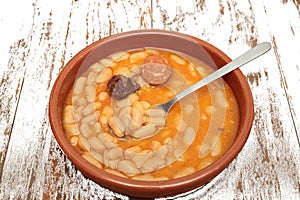 Asturian bean stew in a clay pot.