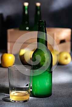 Asturian cider and apples on black background. photo