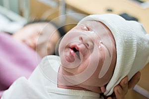 Asuab new born baby is crying in delivery room