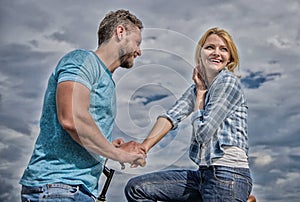 Asual acquaintance concept. Man with beard and shy blonde girl on first date. Couple just meet to hang out together