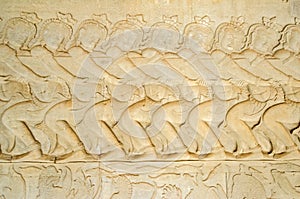 Asuras using the serpent Vasuki to churn the sea on the bas-relief of the Churning of the Sea of Milk in Angkor Wat