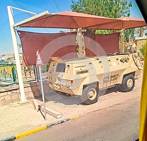 Aswan - Egypt -11 June 2023 :Wrecked military car on edge road near Aswan. Egypt