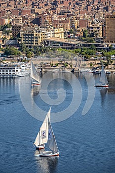 12.11.2018 Aswan, Egypt, A boat felucca sailing along a river Nile on a sunny day against
