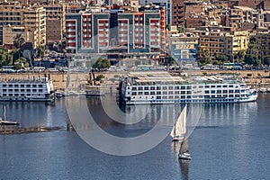 12.11.2018 Aswan, Egypt, A boat felucca sailing along a river of nilies on a sunny day