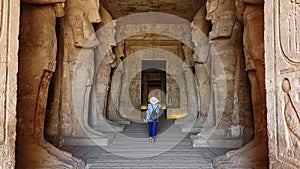 Aswan, Egypt - November 2021: Turist in Great Abu Simbel temple of Pharaoh Ramses II in southern Egypt in Nubia next to