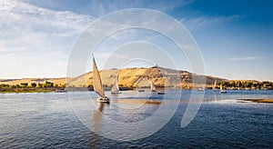 Aswan River Nile Panorama with Felucca Boats at sunset