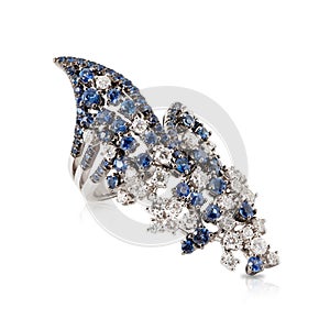 Asymmetric ring in white gold with diamonds and blue sapphires