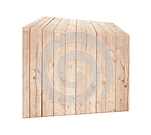 Asymmetrical light brown wooden box in vertical position. photo