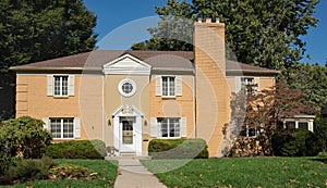 Asymmetrical Tan Brick House photo