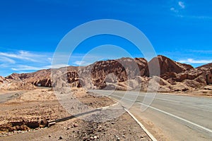 Atacama desert arid landscape and asphalt road