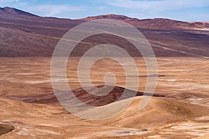 Atacama Desert arid landscape view. Dry mountains with sandstone and no life around us just rocks and sand. A lonely feeling on