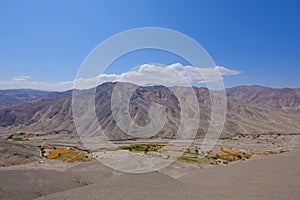 Atacama desert landscape with sand, dunes and mountains, Andes near Huara, Chile