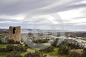 Atalaya watchtower and greenhouses in background, Nijar - Almeria (Spain) photo