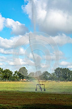 Ð¡atastrophic drought and heat in Europe, nature disaster, irrigation of grass fields