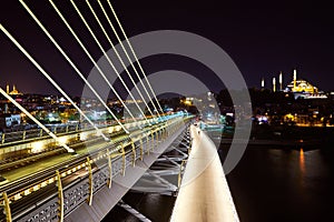 Ataturk metro bridge and golden horn at night - Istanbul, Turkey