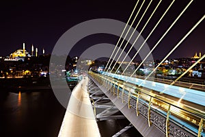 Ataturk metro bridge and golden horn at night - Istanbul, Turkey