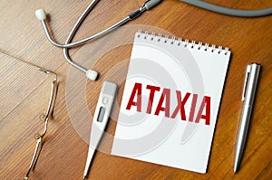 Ataxia inscription by stethoscope on wooden background