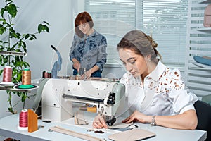 Atelier employees work at workplaces