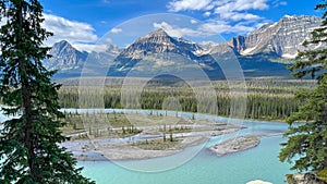 Athabasca River and surrounding mountains along the Ice Fields Parkway in Jasper National Park in Canada