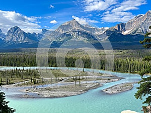 Athabasca River and surrounding mountains along the Ice Fields Parkway in Jasper National Park in Canada