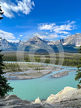 Athabasca River and surrounding mountains along the Ice Fields Parkway in Jasper National Park in Canada