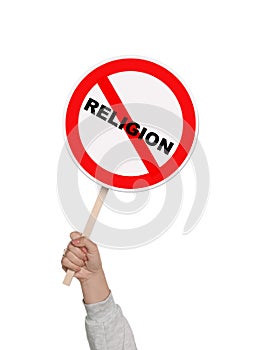 Atheism concept. Woman holding prohibition sign with crossed out word Religion on white background