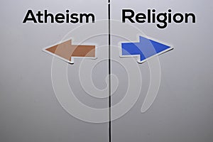 Atheism or Religion with arrow write on white board background