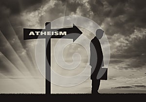 Atheist men stands near road sign Atheism photo