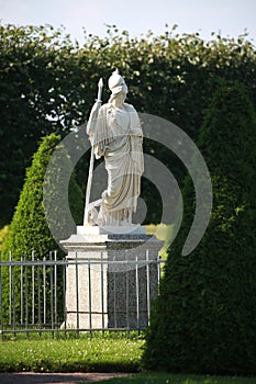 Athena Giustiniani. Marble statue on the background of garden plants. Lower Park, Peterhof