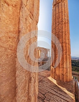 Athena Nike ancient Greek temple between doric columns, Acropolis.