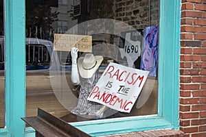 Hand-drawn anti-racist signs on display in the front window of a lounge in downtown Athens  Georgia.