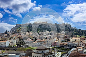 Athens, Greece. Acropolis rock and Monastiraki square, blue sky background, sunny day downtown