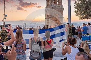 Military ceremony for the lowering of the Greek flag at sunset at Lycabettus Hill in Athens