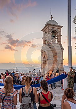 Military ceremony for the lowering of the Greek flag at sunset at Lycabettus Hill in Athens