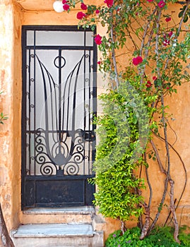 Athens Greece, vintage metal and glass house door, anafiotika picturesque neighborhood under acropolis