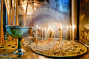 Athens Greece. Votive candles inside the orthodox church Ekklisia Panagia Grigorousa Agii Taxiarches ke Agios Fanourios