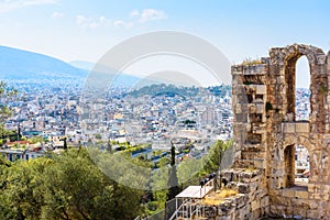 Athens skyline, Greece. View from Acropolis, ruins of Odeon of Herodes Atticus in foreground