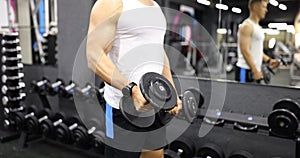 Athlete in activewear lifting dumbbells for exercise