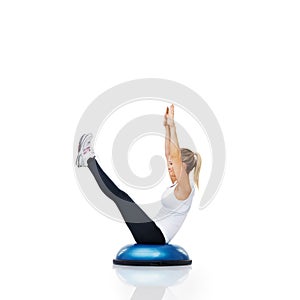 Athlete, ball or body exercise in workout for abs or core strength isolated on white background. Woman stretching