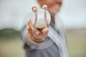 Athlete with baseball in hand, man holding ball on outdoor sports field or pitch in New York stadium. American baseball photo