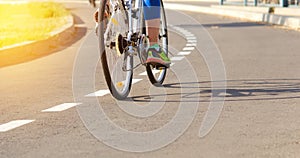 Athlete on a bike path trains outdoors on a bicycle to achieve victories in the sport.