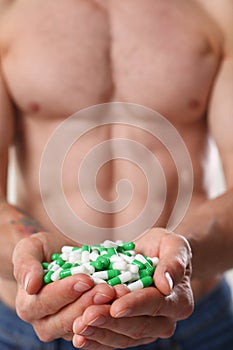 Athlete bodybuilder takes dope in the form of tablets form of pharma rapid progress in muscle