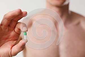 Athlete bodybuilder takes dope in the form of tablets form of pharma rapid progress in muscle