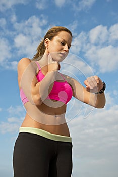 Athlete checking her pulse