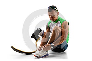 Athlete disabled amputee isolated on white studio background